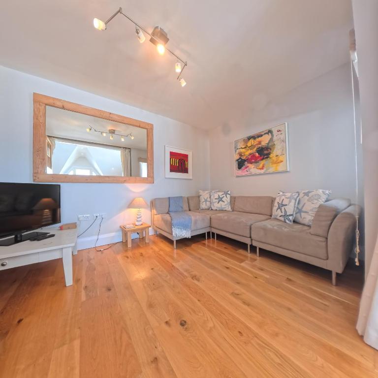 Living space at Tate Five with parquet floors and natural light